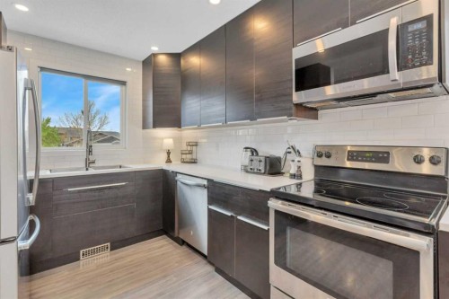 57 Erickson Drive, Red Deer, AB - Indoor Photo Showing Kitchen With Upgraded Kitchen