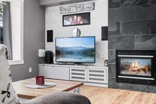 2034 Luxstone Boulevard Sw, Airdrie, AB - Indoor With Fireplace