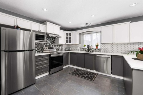 2034 Luxstone Boulevard Sw, Airdrie, AB - Indoor Photo Showing Kitchen With Upgraded Kitchen