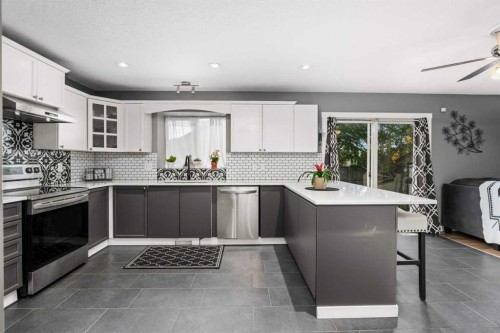 2034 Luxstone Boulevard Sw, Airdrie, AB - Indoor Photo Showing Kitchen With Upgraded Kitchen