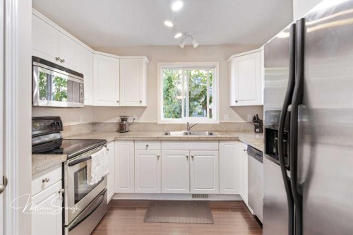 5851 58 Avenue, Red Deer, AB - Indoor Photo Showing Kitchen With Stainless Steel Kitchen With Double Sink