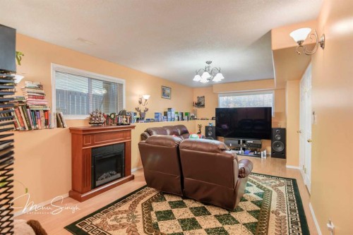 5851 58 Avenue, Red Deer, AB - Indoor Photo Showing Living Room With Fireplace