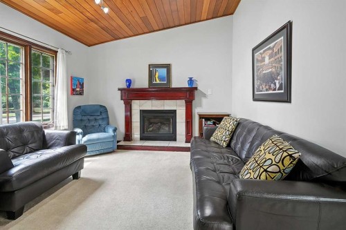 4758 56 Street, Red Deer, AB - Indoor Photo Showing Living Room With Fireplace
