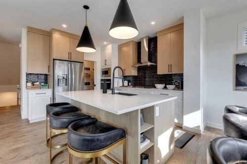 134 Saddlebred Place, Cochrane, AB - Indoor Photo Showing Kitchen With Stainless Steel Kitchen With Upgraded Kitchen