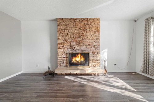 844 Rundlecairn Way Ne, Calgary, AB - Indoor Photo Showing Living Room With Fireplace