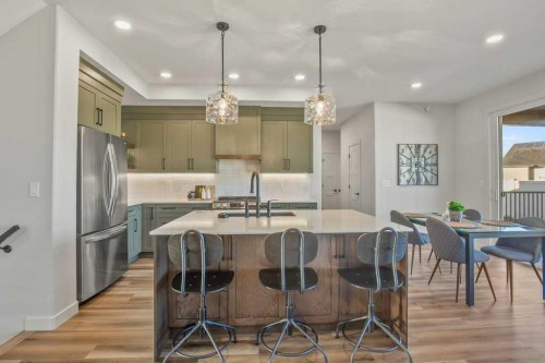 62 Eaton Crescent, Red Deer, AB - Indoor Photo Showing Kitchen With Stainless Steel Kitchen With Upgraded Kitchen