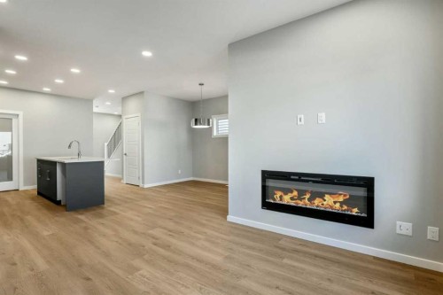 20 Heartwood Lane Se, Calgary, AB - Indoor Photo Showing Living Room With Fireplace
