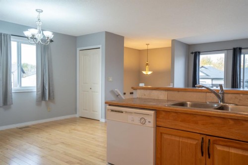 4521 Van Eaton Way, Clive, AB - Indoor Photo Showing Kitchen With Double Sink
