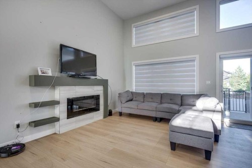 232 Emerald Drive, Red Deer, AB - Indoor Photo Showing Living Room With Fireplace