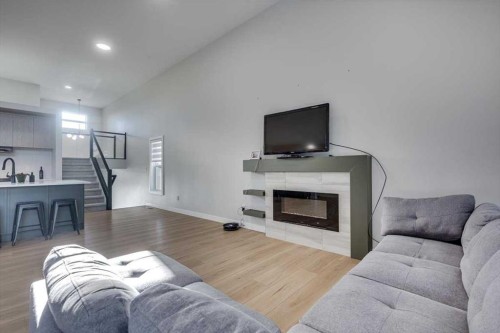 232 Emerald Drive, Red Deer, AB - Indoor Photo Showing Living Room With Fireplace