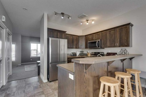 111-50 Lucky Place, Sylvan Lake, AB - Indoor Photo Showing Kitchen With Stainless Steel Kitchen