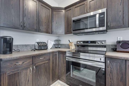111-50 Lucky Place, Sylvan Lake, AB - Indoor Photo Showing Kitchen