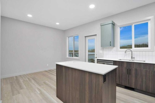 122 Gray Close, Sylvan Lake, AB - Indoor Photo Showing Kitchen With Double Sink