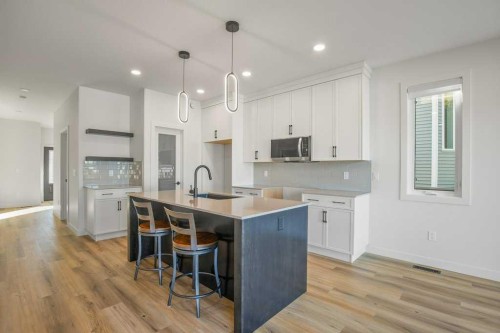 151 Cedar Square, Blackfalds, AB - Indoor Photo Showing Kitchen With Upgraded Kitchen