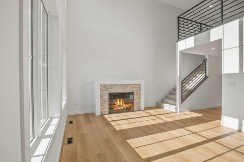 5 Songbird Green, Sylvan Lake, AB - Indoor Photo Showing Other Room With Fireplace