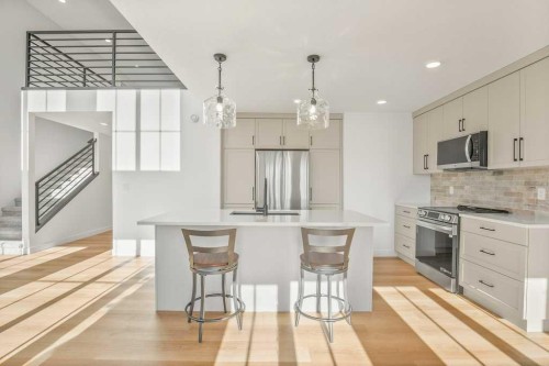 5 Songbird Green, Sylvan Lake, AB - Indoor Photo Showing Kitchen With Upgraded Kitchen