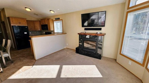 28-32351 Range Road 55, Rural Mountain View County, AB - Indoor Photo Showing Kitchen With Fireplace