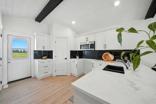62 Metcalf Way, Lacombe, AB - Indoor Photo Showing Kitchen With Double Sink