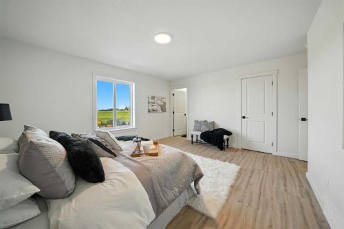 62 Metcalf Way, Lacombe, AB - Indoor Photo Showing Bedroom