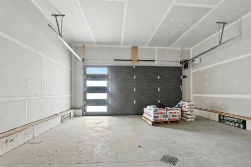 62 Metcalf Way, Lacombe, AB - Indoor Photo Showing Garage