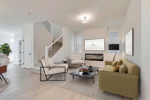 612 Buffaloberry Manor Se, Calgary, AB - Indoor Photo Showing Living Room With Fireplace