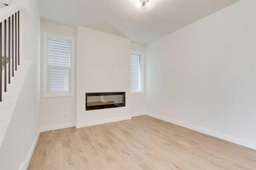 612 Buffaloberry Manor Se, Calgary, AB - Indoor With Fireplace