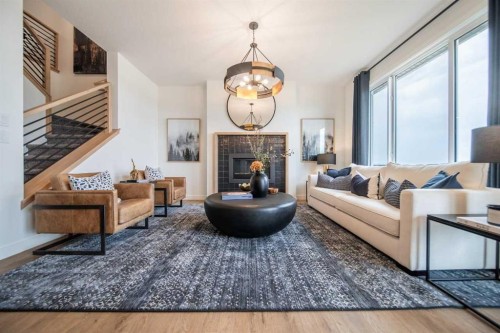 704 Langley Terrace Se, Airdrie, AB - Indoor Photo Showing Living Room With Fireplace
