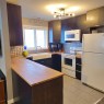 69 Willow Springs Crescent, Sylvan Lake, AB  - Indoor Photo Showing Kitchen With Double Sink 
