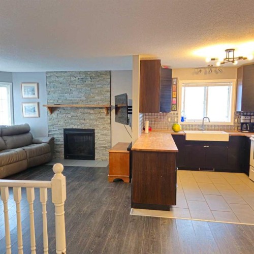 69 Willow Springs Crescent, Sylvan Lake, AB - Indoor Photo Showing Living Room With Fireplace
