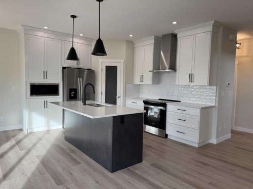 38 Tagish Avenue, Red Deer, AB - Indoor Photo Showing Kitchen With Stainless Steel Kitchen With Upgraded Kitchen