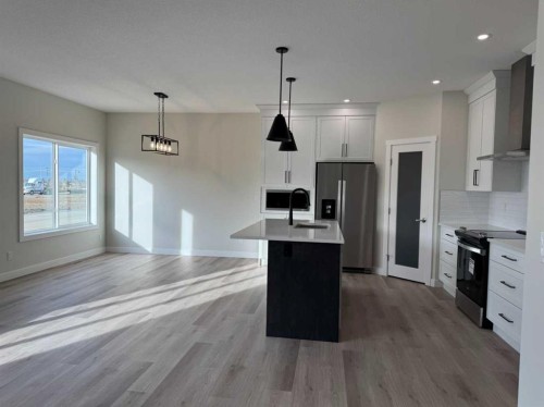 38 Tagish Avenue, Red Deer, AB - Indoor Photo Showing Kitchen With Stainless Steel Kitchen With Upgraded Kitchen