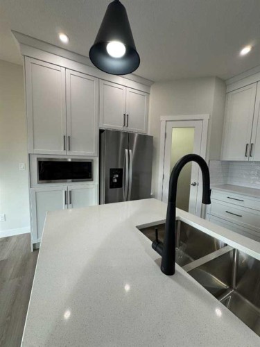 38 Tagish Avenue, Red Deer, AB - Indoor Photo Showing Kitchen With Double Sink