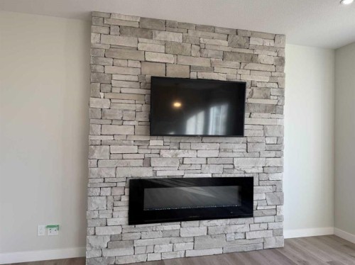 38 Tagish Avenue, Red Deer, AB - Indoor Photo Showing Living Room With Fireplace