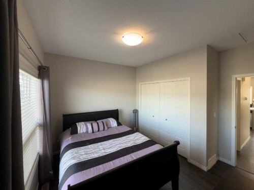 129 Henderson Crescent, Penhold, AB - Indoor Photo Showing Bedroom