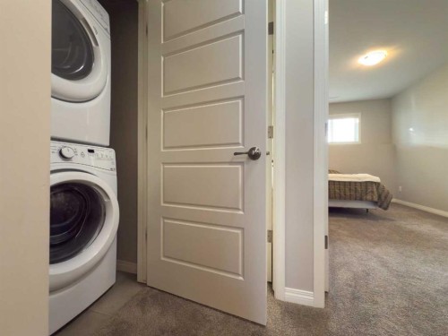129 Henderson Crescent, Penhold, AB - Indoor Photo Showing Laundry Room