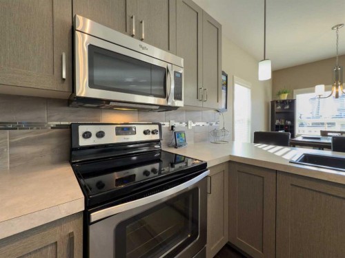 129 Henderson Crescent, Penhold, AB - Indoor Photo Showing Kitchen With Stainless Steel Kitchen