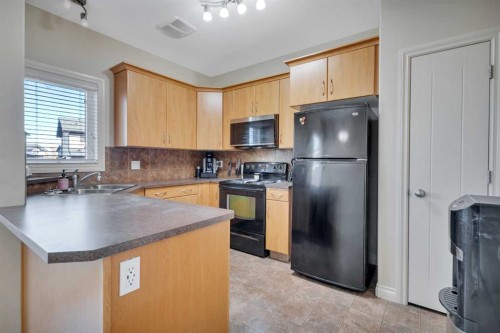 101 Piper Close, Blackfalds, AB - Indoor Photo Showing Kitchen With Double Sink