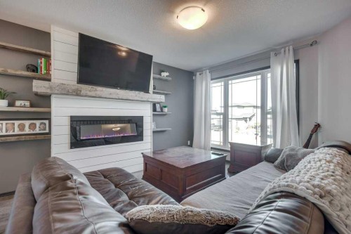 13 Adina Close, Blackfalds, AB - Indoor Photo Showing Living Room With Fireplace