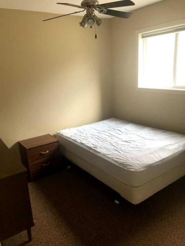 7017 Deer Street, Lacombe, AB - Indoor Photo Showing Bedroom