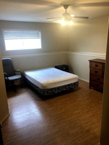7017 Deer Street, Lacombe, AB - Indoor Photo Showing Bedroom