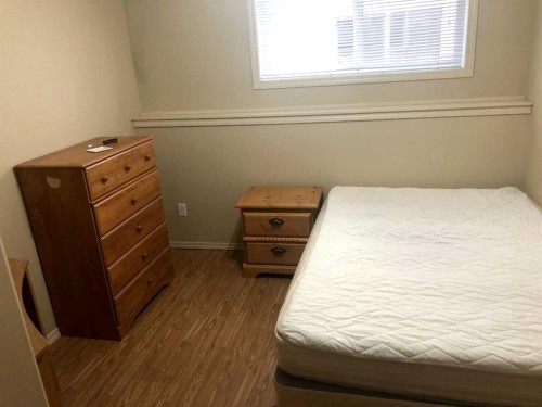 7017 Deer Street, Lacombe, AB - Indoor Photo Showing Bedroom