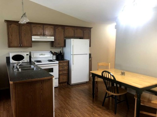 7017 Deer Street, Lacombe, AB - Indoor Photo Showing Kitchen With Double Sink