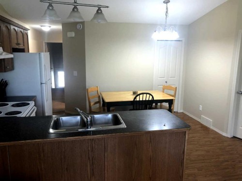 7017 Deer Street, Lacombe, AB - Indoor Photo Showing Kitchen With Double Sink