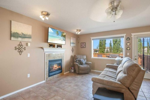 431 Carriage Lane Crossing, Carstairs, AB - Indoor Photo Showing Living Room With Fireplace