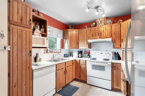5014 43 Street, Sylvan Lake, AB - Indoor Photo Showing Kitchen With Double Sink
