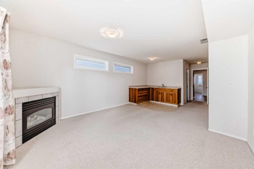 4819 45 Avenue, Innisfail, AB - Indoor With Fireplace