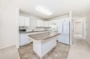 4819 45 Avenue, Innisfail, AB  - Indoor Photo Showing Kitchen With Double Sink 