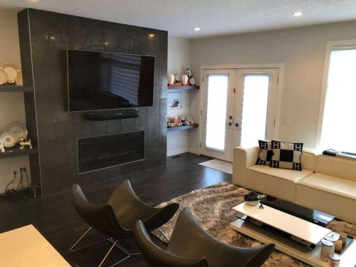 2312 Westmount Road Nw, Calgary, AB - Indoor Photo Showing Living Room With Fireplace
