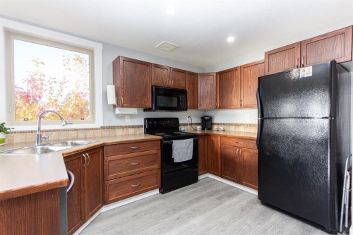 347 Addington Drive, Red Deer, AB - Indoor Photo Showing Kitchen With Double Sink