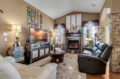 3 Legacy Cove, Sylvan Lake, AB - Indoor Photo Showing Living Room With Fireplace